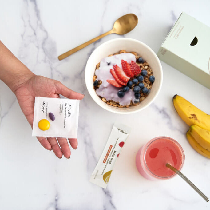 Expectant mother holding a variety of nutritious foods, emphasizing the vital role of nutrition during pregnancy for both mom and baby's health.
