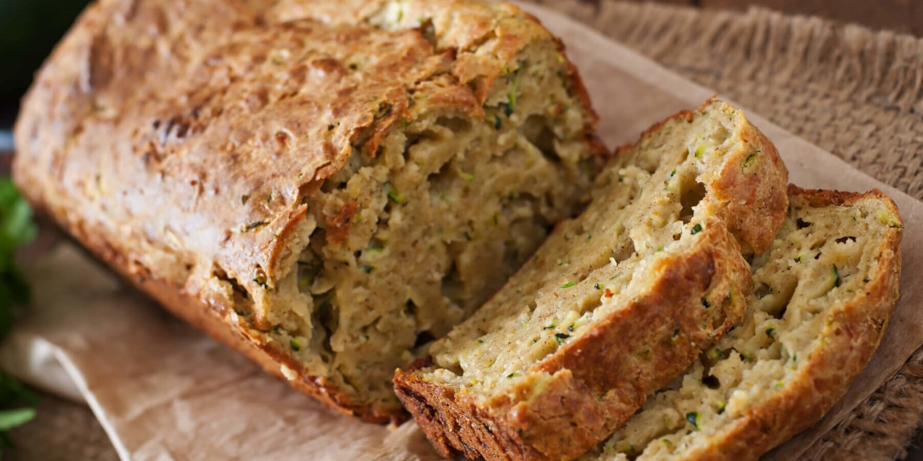 Zucchini bread with cheese on a wooden background AdobeStock e