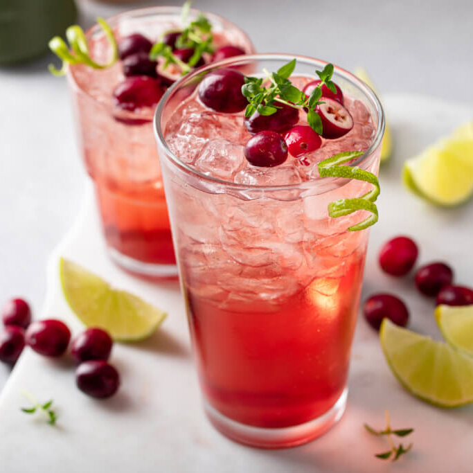 Cranberry and lime cocktail or mocktail, festive refreshing drink idea for the holiday dinner